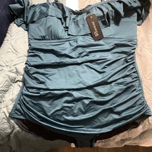 Medium Citychic swimsuit in a dark teal you can wear straps in different ways.